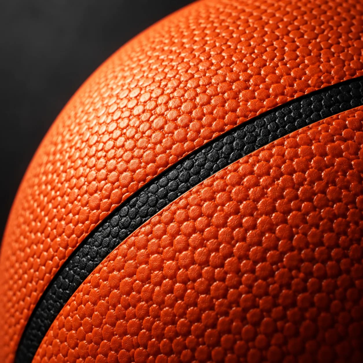 Macro view of the Precision basketball's textured composite leather and channel